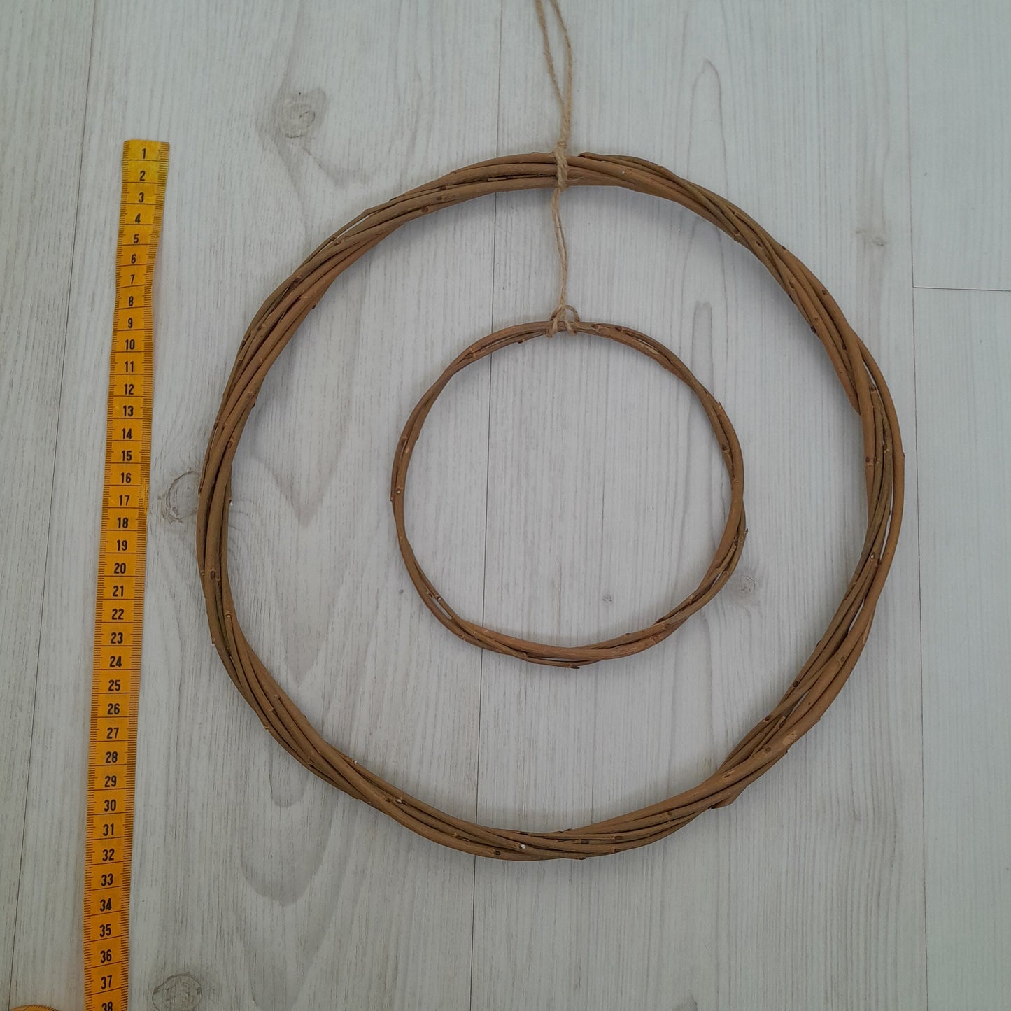 Brown willow hoops for floristry and crafts, double hoop thin wreath base. Wicker hoop in a hoop, hanging willow rings.