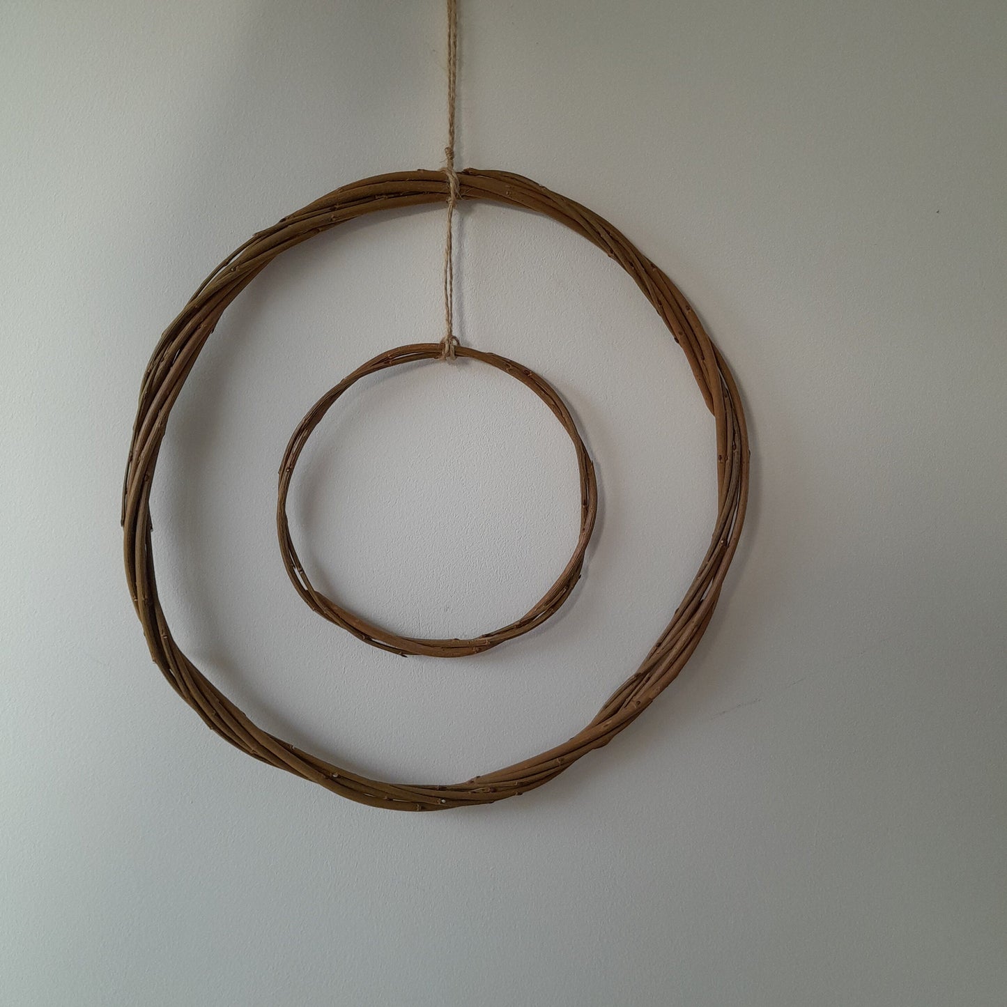 Brown willow hoops for floristry and crafts, double hoop thin wreath base. Wicker hoop in a hoop, hanging willow rings.